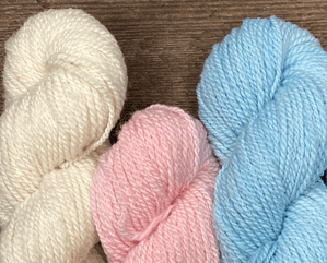 cream pink and blue hanks of yarn